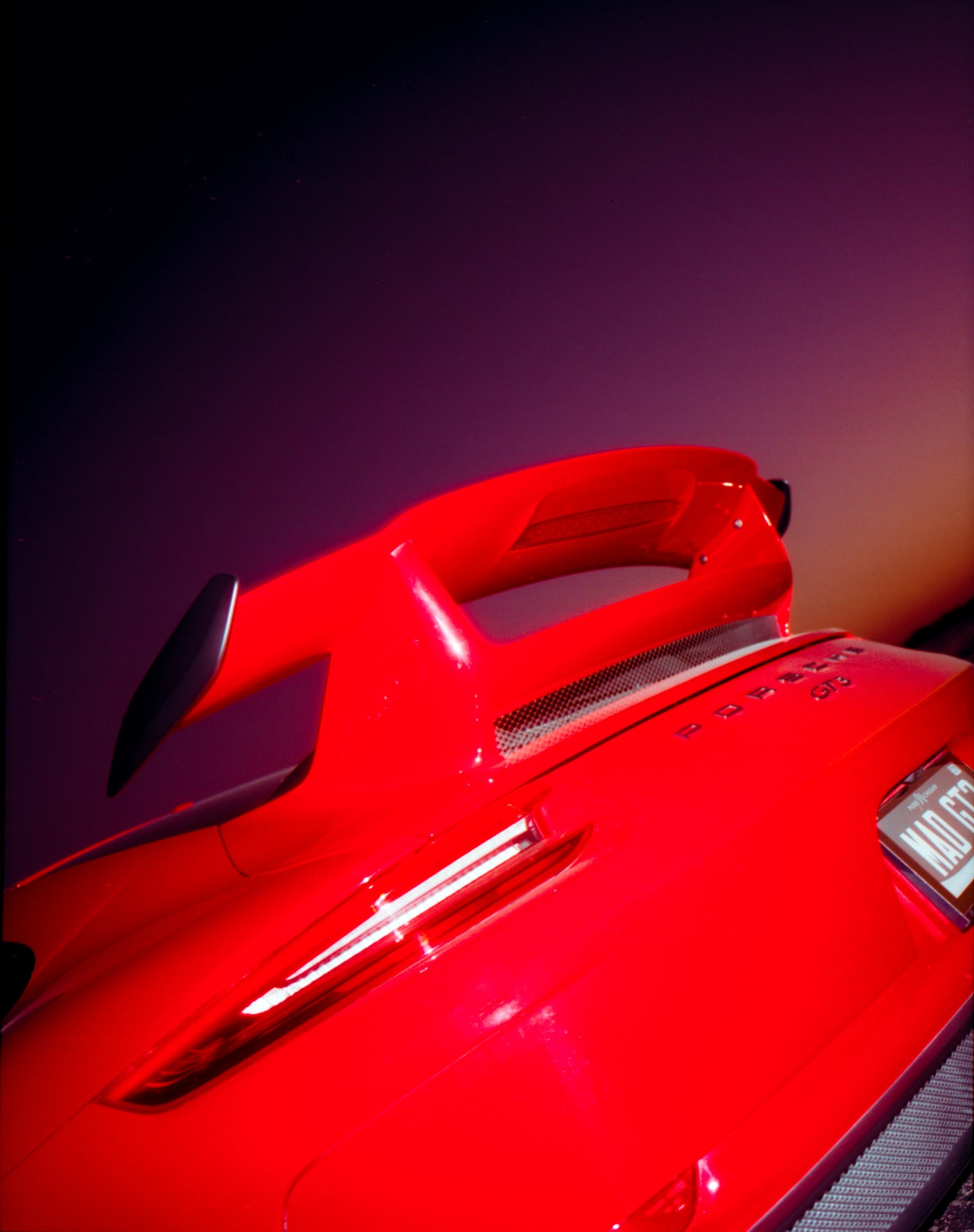 Guards Red GT3 During Sunset on Film